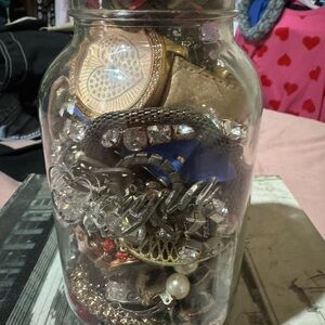 Jewelry in a jar, mixture of broken pieces and odds and ends